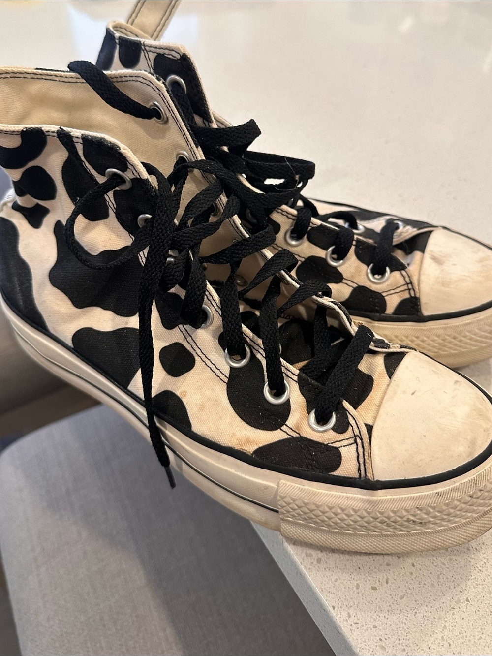 Converse High-Top Sneakers in Black and Cream Cow Print